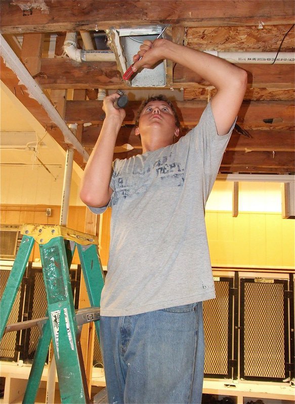 Image: Current Gladiator, Bailey Walton, a junior, does his part during the renovation.