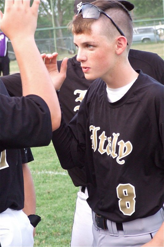 Image: Gladiator freshman Ty Windham(8) helps keep his teammates fired up.