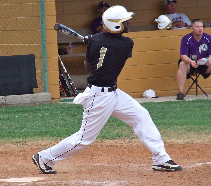 Image: Gladiator senior Marvin Cox(1) hits one past the Indians.