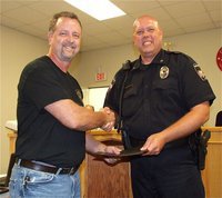 Image: Kelly Westbrook receives his diploma from Italy Police Chief Diron Hill as a member of the first class Citizens Police Academy graduates.