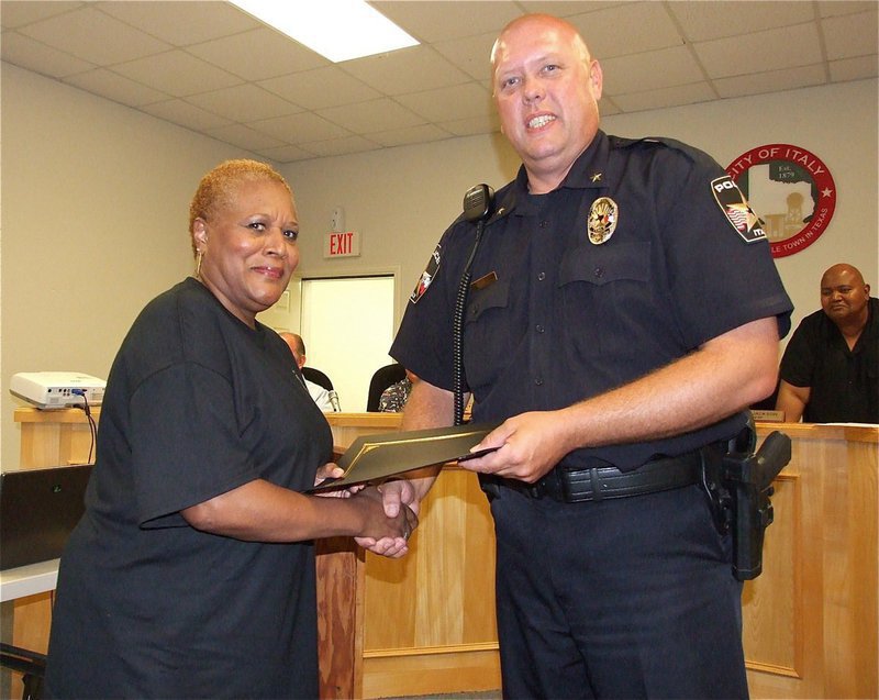 Image: Elmerine Allen Bell, who has never shied away from being a pioneer of worthwhile causes, accepts her diploma from Italy Police Chief Diron Hill as a member of the first class of graduates of the Citizens Police Academy.
