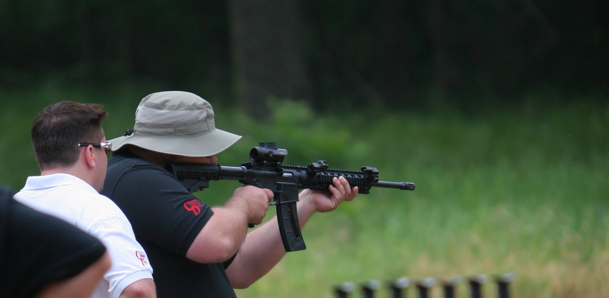 Image: Tolliver shooting an assault rifle for one of the Invitational stages.