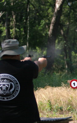 Image: Simultaneous revolver shooting stage of competition.
