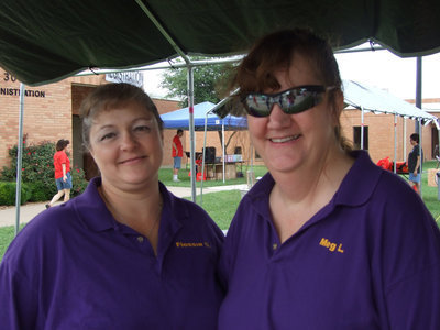 Image: Local Lions Club members, Flossie Gowin and Meg Lyons, helped out wherever they could.