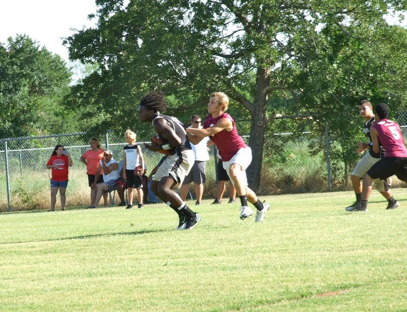 Image: Italy Gladiator Ryheem Walker hauls in a pass across the middle during a 7-on-7 summer league matchup against 3A Riesel played in Axtell.