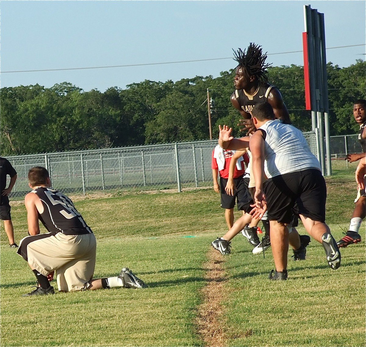 Image: Ryheem Walker(10) leaps at the goal line to catch a touchdown pass from Marvin Cox.