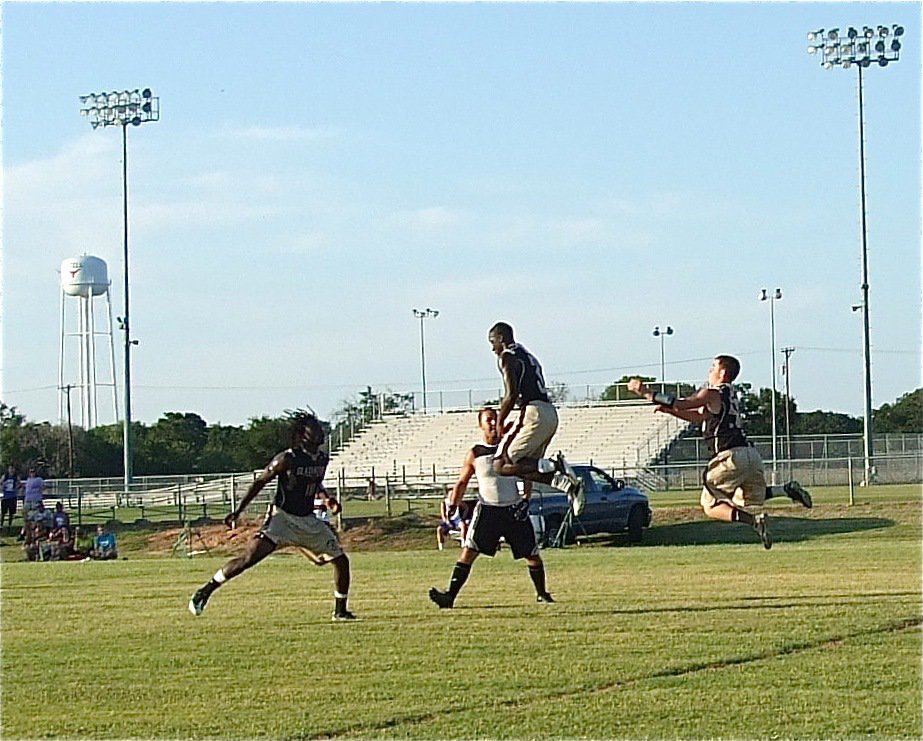 Image: Ryheem Walker(10) and Hayden Woods(50) zoom in while Marvin Cox(3) picks off a Dawson pass to finish off the Bulldogs 20-0 for their Italy’s third win on the afternoon.