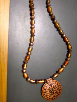 Image: Stunning necklace in copper tones.