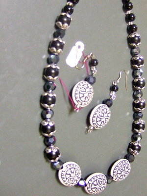 Image: Black and white beaded necklace and earrings.