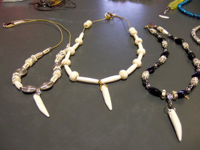 Image: Three necklaces of African boars’ tusk.