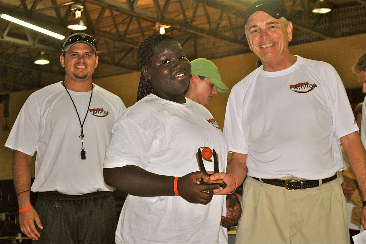 Image: Andrew Harlow and Sam Nichols celebrate awards day with the Basketball Smile Campers.