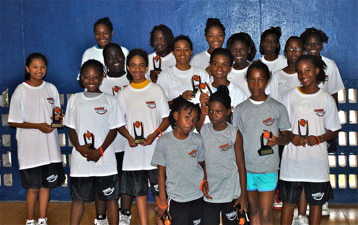 Image: Girl trophy recipients during the 13th Annual Basketball Smiles camp in Nassau, Bahamas.