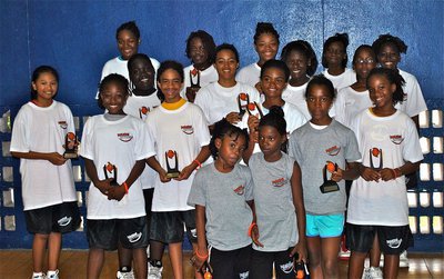 Image: Girl trophy recipients during the 13th Annual Basketball Smiles camp in Nassau, Bahamas.