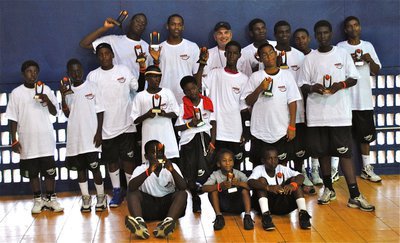 Image: Boy trophy recipients during the 13th Annual Basketball Smiles camp in Nassau, Bahamas.