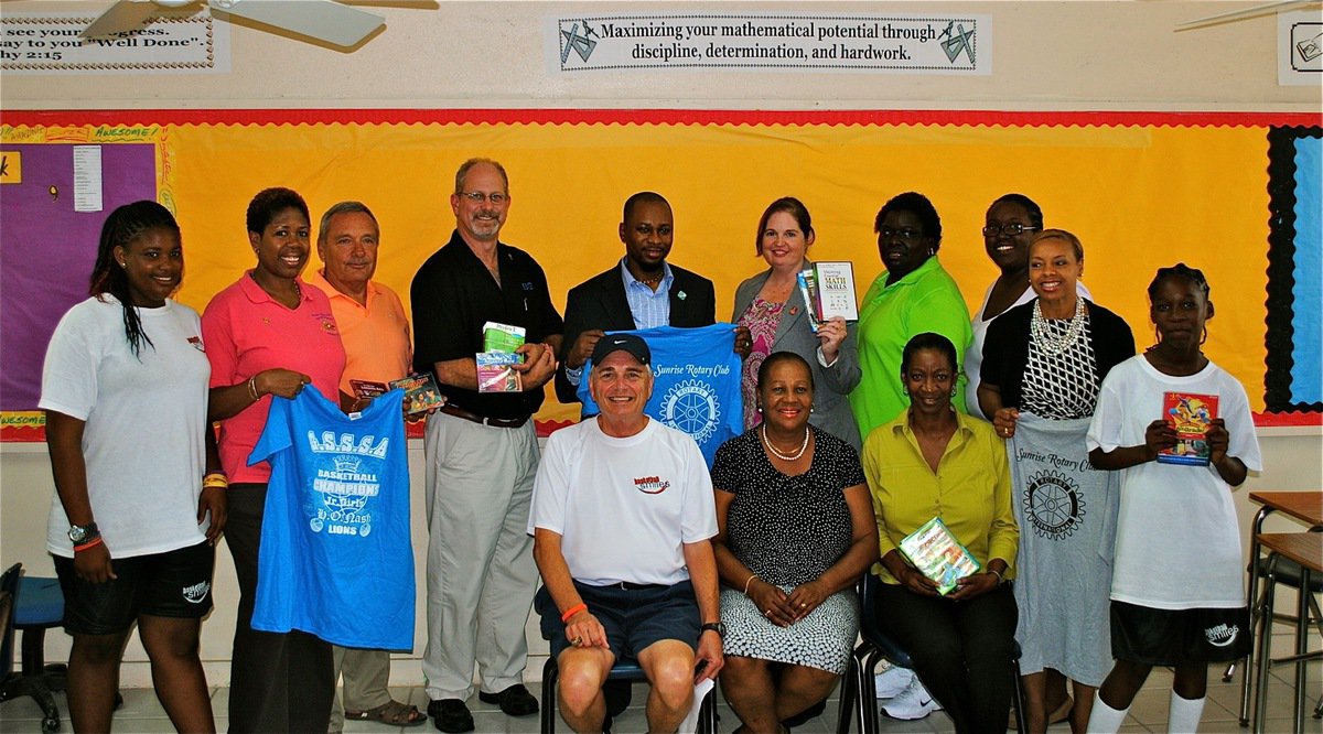 Image: The Nassau Rotary Club plays a crucial role during camp Basketball Smiles, taking upon themselves to deliver G.S.S.S.A. Basketball Championship Shirts to the Jr. Girl campers that had previously won the equivalent of a district championship back during the school year but never got to really celebrate their accomplishment. The Rotary Club helped the coaches get to and from camp everyday to avoid paying cab fare. They also, along with Basketball Smiles Coaches, provided educational software to the campers of a local junior high. 