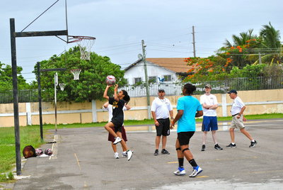 Image: Going to the basket during the Basketball Smiles camp….determined to be successful in life.