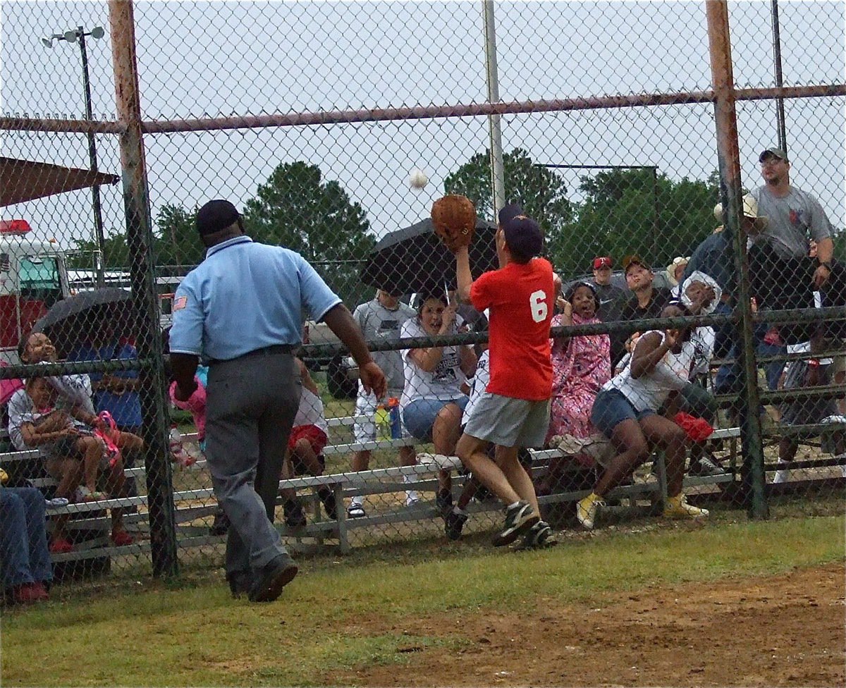 Image: I.F.D. catcher Randy Boyd rushes into service after a foul ball but mostly manages to petrify the fans.