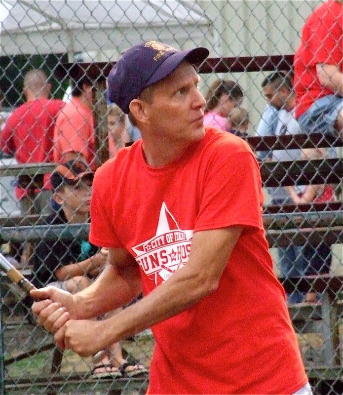 Image: Randy Boyd sees a pitch he likes as the Italy Fire Department builds an early lead.