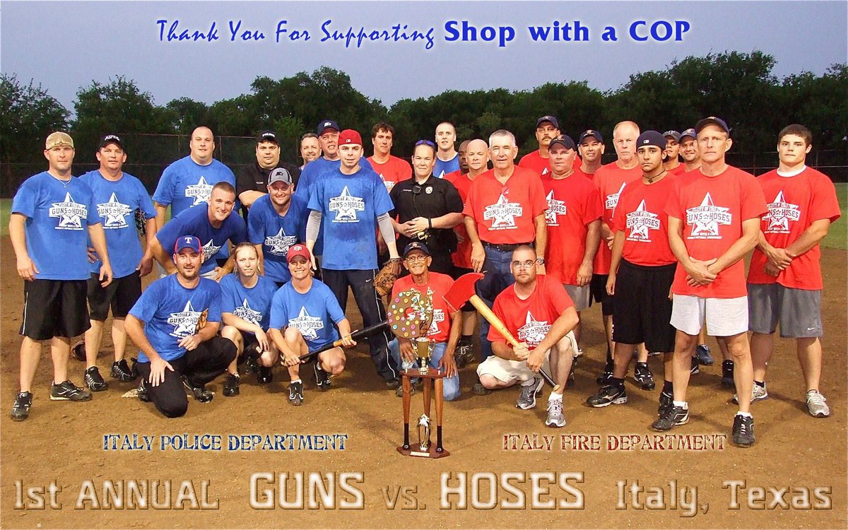 Image: The Italy Police Department and the Italy Fire Department competed in a Guns Vs. Hoses matchup to raise money for “Shop with a Cop” that provides toys at Christmas to deserving children and a traditional meal to their families.