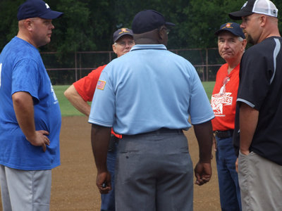 Image: Everyone meets at the plate for the coin flip.