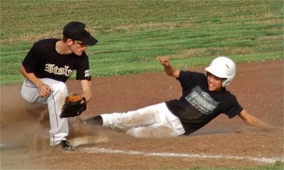 Image: Justn Wood(4) attempts a tag at third base but the Zebra runner beats the throw.