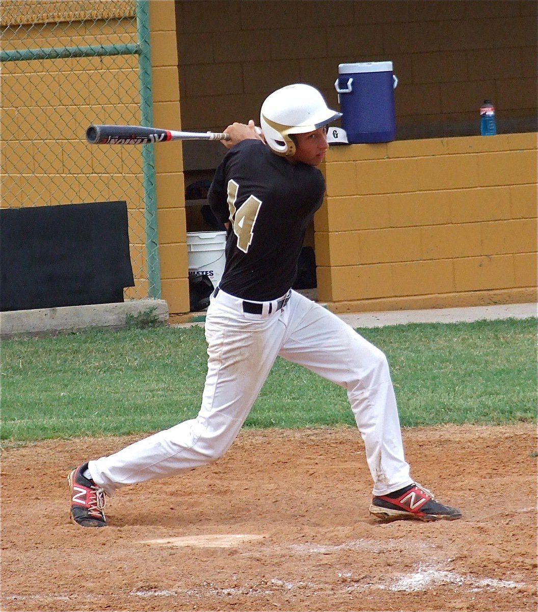 Image: Brett Pickard sends a shot down the first base line.