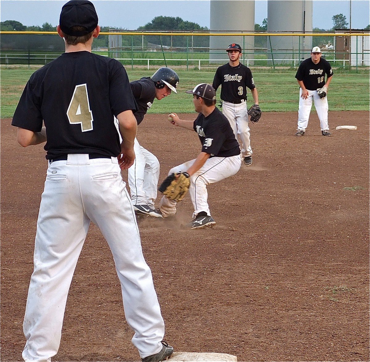 Image: Tyler Anderson storms off the mound trying to tag a Zebra runner during a rundown.