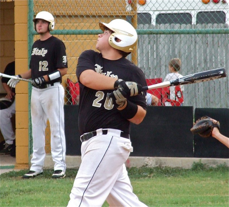 Image: Kevin Roldan(20) rips a single into right field, mesmerizing teammate Zackery Boykin(12).