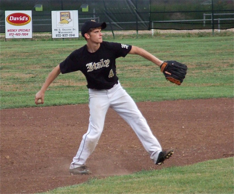 Image: Italy’s third baseman Justin Wood continues to work late in game two.