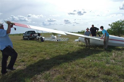 Image: Mike gives one last twist to separate the wing with help from Alan and Jacob.