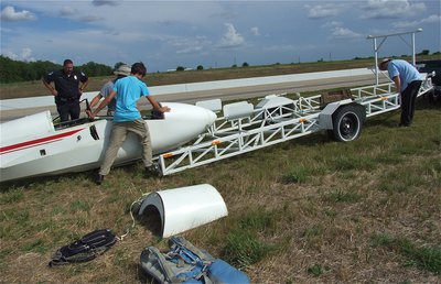 Image: Loading the wingless glider onto the custom trailer for transport.