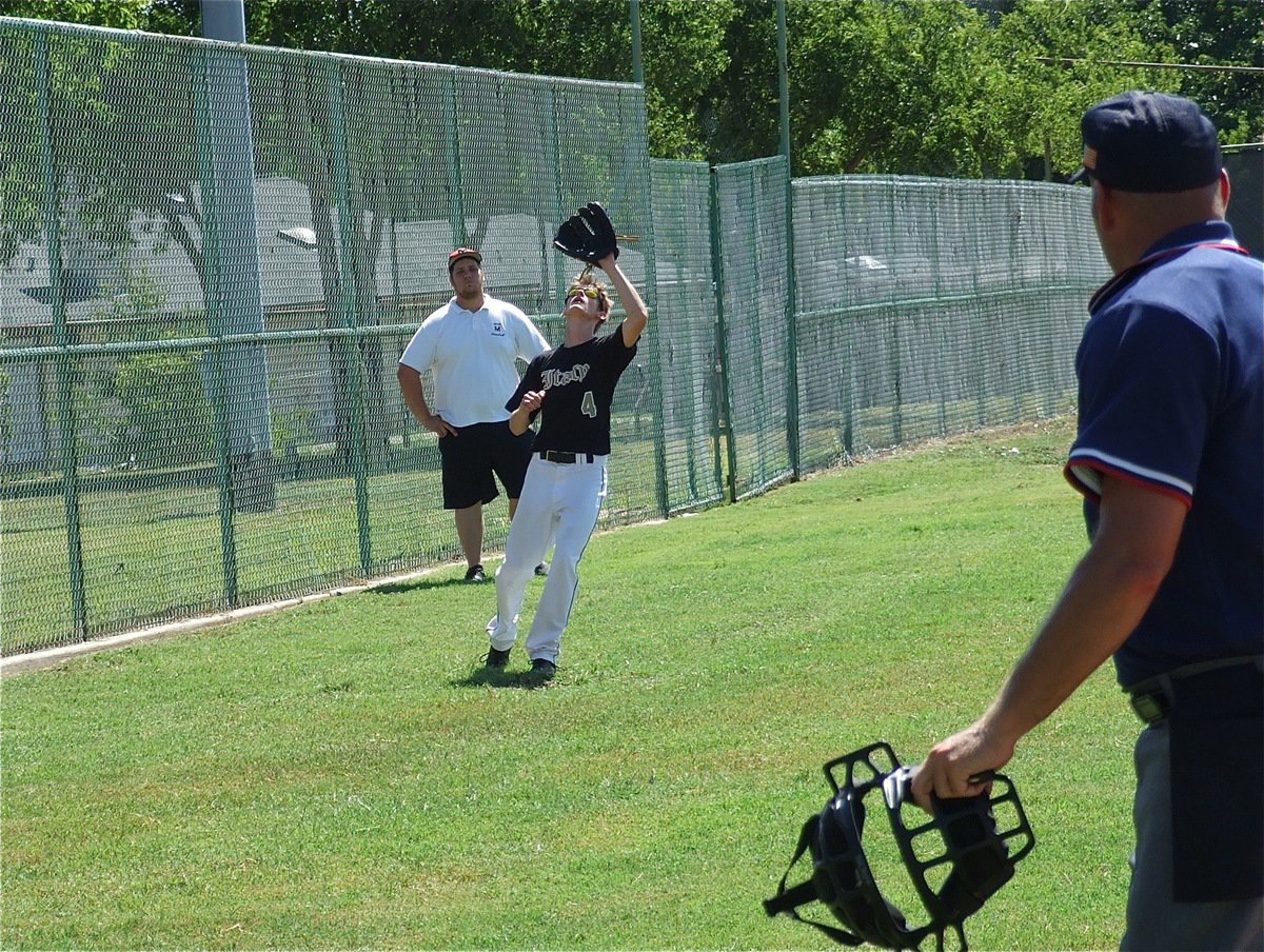 Image: Italy’s third baseman Justin Wood gets under a Mexia foul ball for an out during pool play.