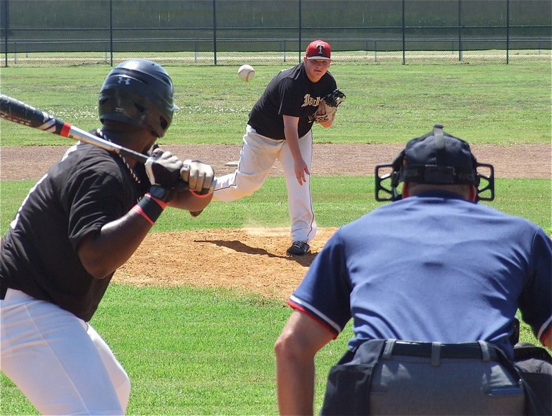 Image: Italy pitcher John Byers(18) takes on Mexia’s long ball hitter.