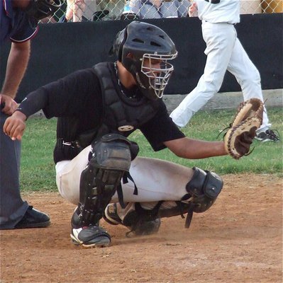 Image: Italy’s Reid Jacinto secures the ball while playing catcher.