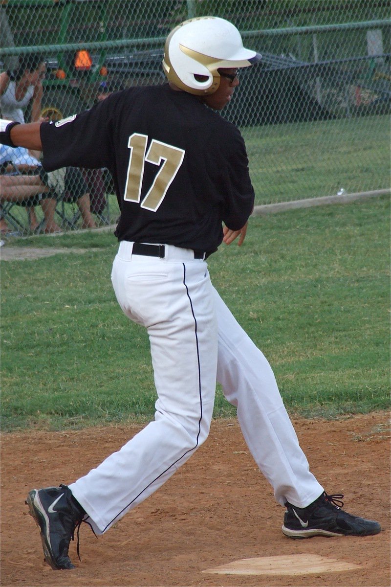 Image: Italy’s John “Squirt” Hughes(17) takes a swing at Dawson during pool play of the State tournament.