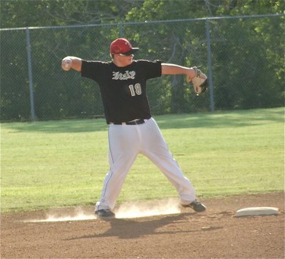 Image: John Byers gets warmed up at second base.