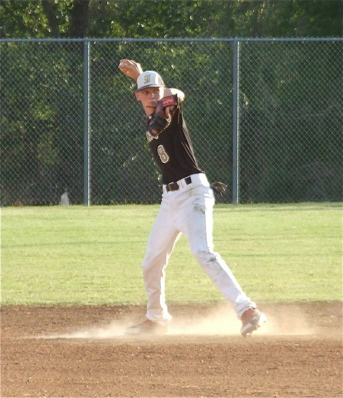 Image: Freshman Ty Windham(8) stirs up some dust at second base for Italy.