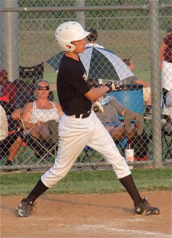 Image: Italy freshman Ryan Connor lofts a pitch into centerfield.