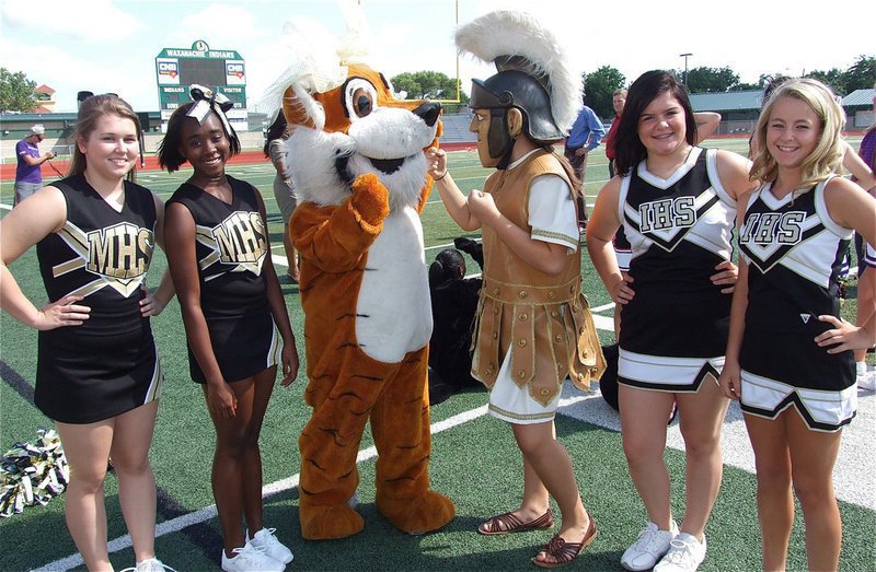 Image: Uh, oh! Malakoff’s mascot “Tigra,” aka Meaghan Morton, a sophomore, and Italy Gladiator mascot, Reagan Adams, also a sophomore, argue over which school is more #1!