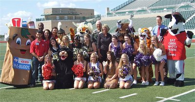 Image: Dale Hansen, the H-E-B and Chick-fil-a mascots and representatives, WFAA Channel 8 and City Credit Union representatives, participating high school cheerleaders and their team mascots join together in a colorful group photo to promote the inaugural Dale Hansen Football Classic.