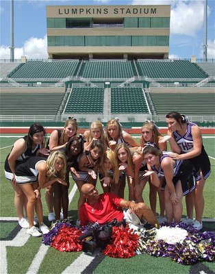 Image: The cheerleaders show their appreciation to the very patient WFAA Channel 8 Sports Videographer Arnold Payne after filming for the Dale Hansen Football Classic commercial which will air the few weeks leading up to September 7-8.