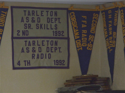 Image: There are many flags, pennants and plaques to decorate the room.