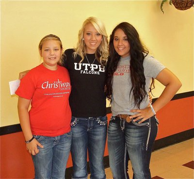 Image: Three of a kind: UTEP’s Megan Richards receives hugs from both of her little sisters, Brycelyn Richards and Alyssa Richards, after signing up to be a Falcon. All three sisters share a passion for the game.