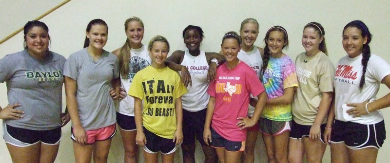 Image: New IHS Volleyball Coach, Jessika Robinson, stands in the middle of a few of the 2012-13 Lady Gladiators, as she watches a voluntary strength and conditioning session with some of her new student/athletes. Coach will meet all the high school girls wanting to play volleyball at try-outs on Aug. 6th.
