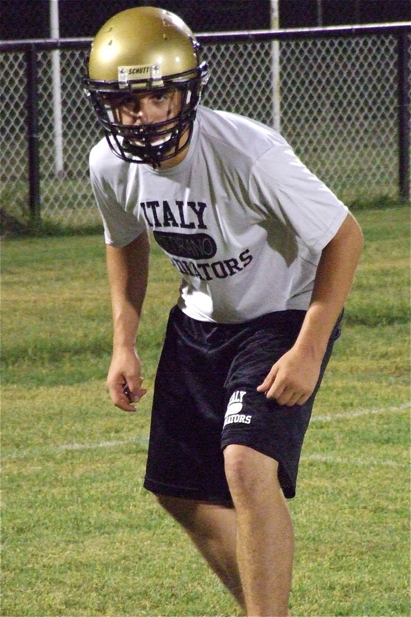 Image: Cody Medrano, a junior, works on defensive pass coverage during Midnight Madness.