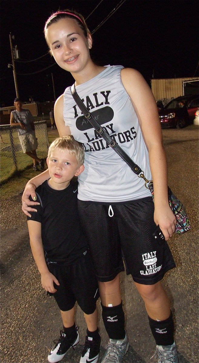 Image: Lady Gladiator Volleyball player Amber Hooker gets a “good job” hug from Dustyn Duke.