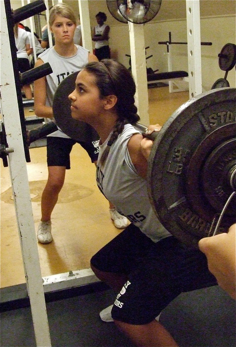 Image: Halee Turner helps spot Ashlyn Jacinto as the freshman get work done.