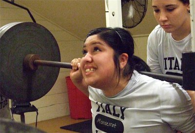 Image: Monserrat Figueroa squats 325 lbs. with Alyssa Richards spotting.