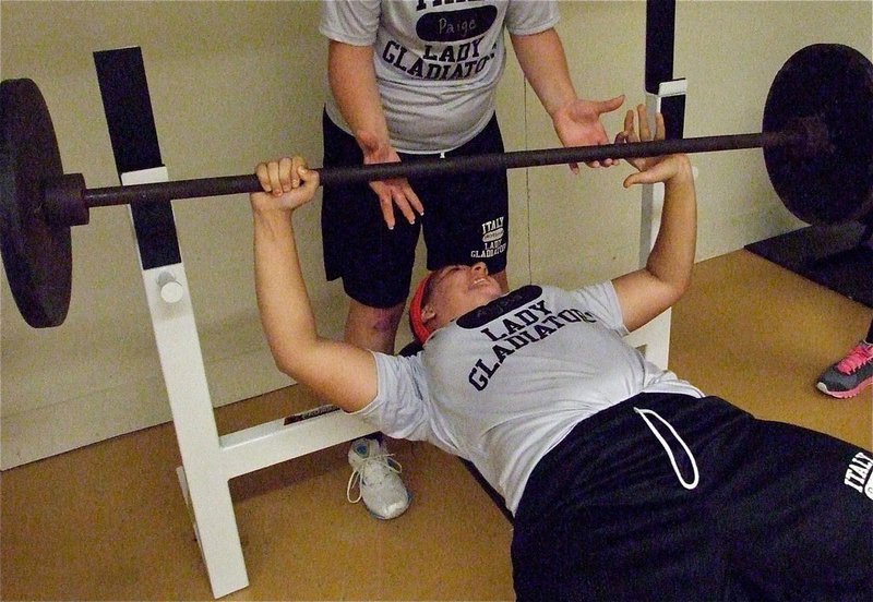 Image: Alyssa Richards battles the the weight on the bar.