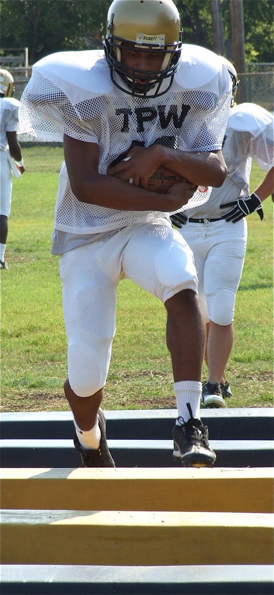 Image: Jaray Anderson(40) works on getting those knees up.